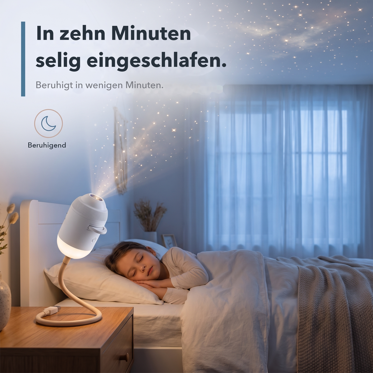 Kind schläft beim Sternenlicht des StarDream-Projektors